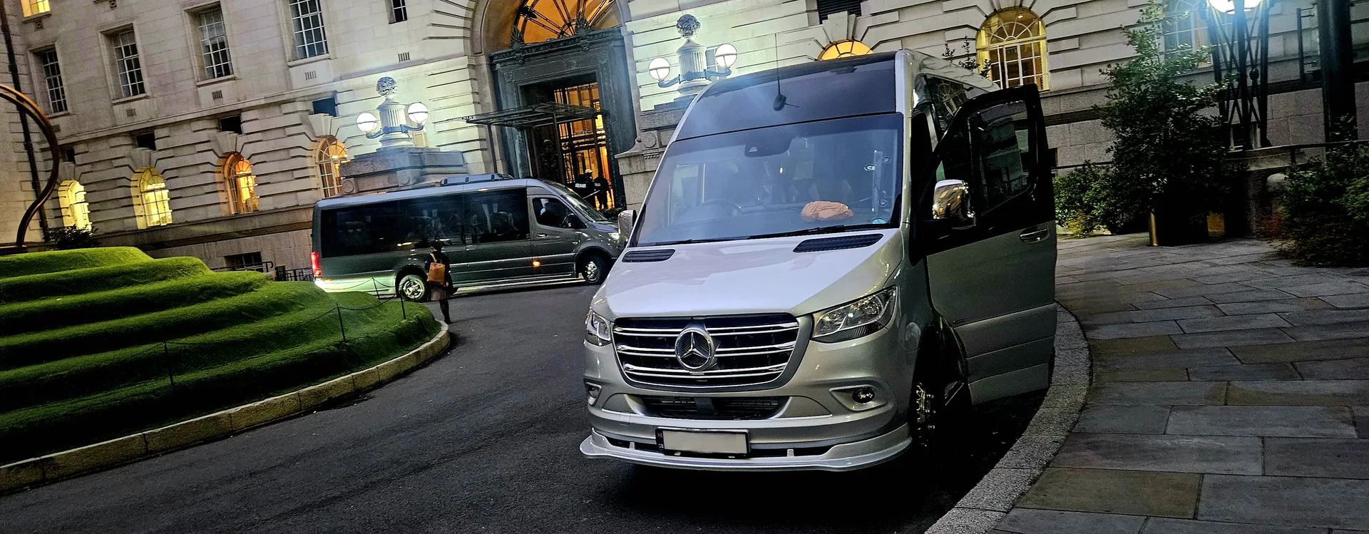 Executive minibus fleet outside a luxury London hotel for Heathrow airport transfer
