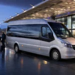 Coach park at Heathrow Airport with multiple minibuses and coaches parked for group pickups